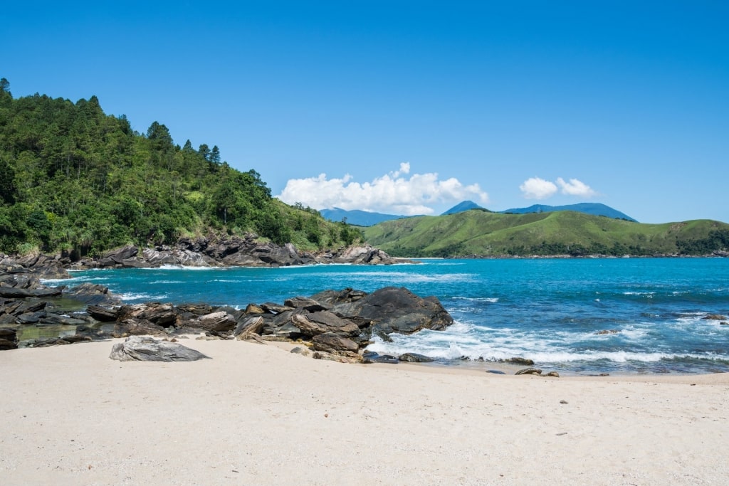 Beautiful beach of Maresias, Brazil with rocky shore