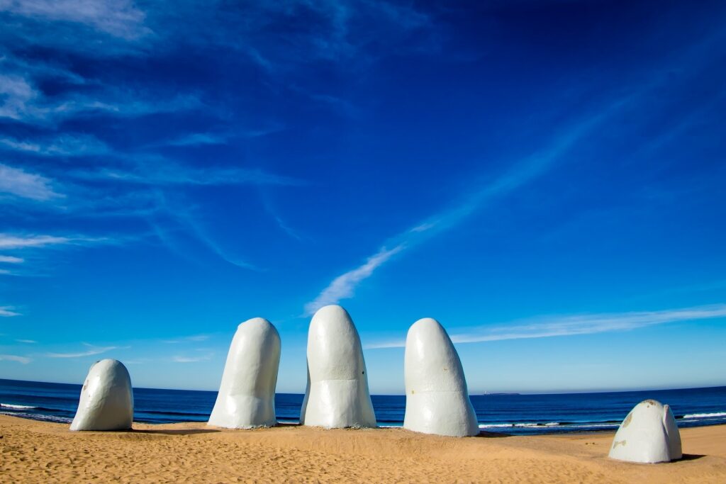 Iconic La Mano sculpture by the shore of Playa Brava, Uruguay