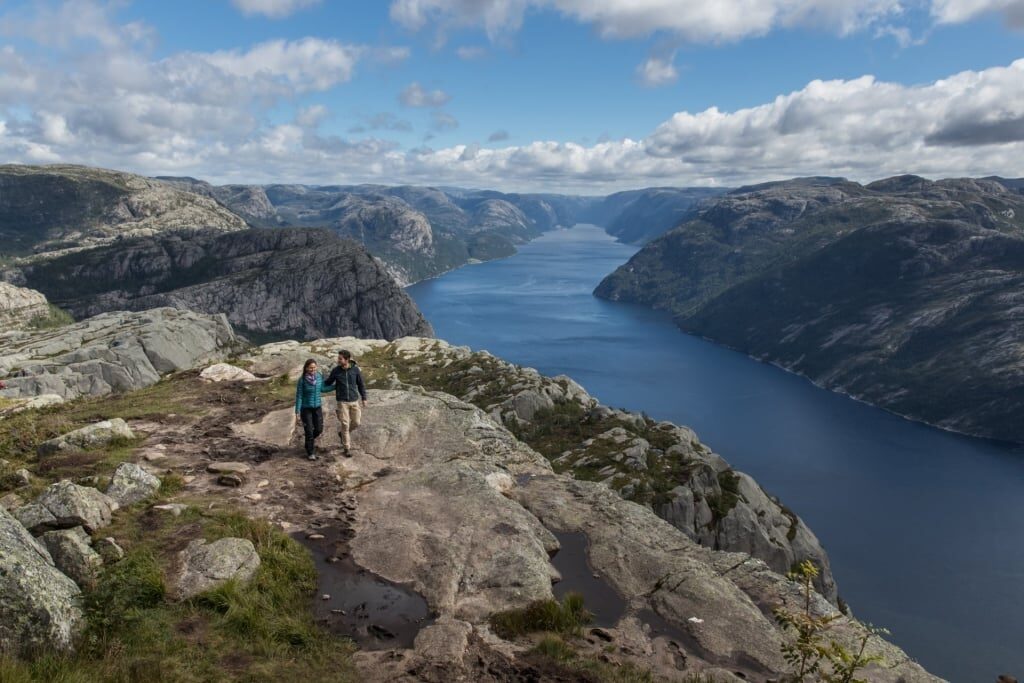 Couple hiking the Pulpit Rock, Norway