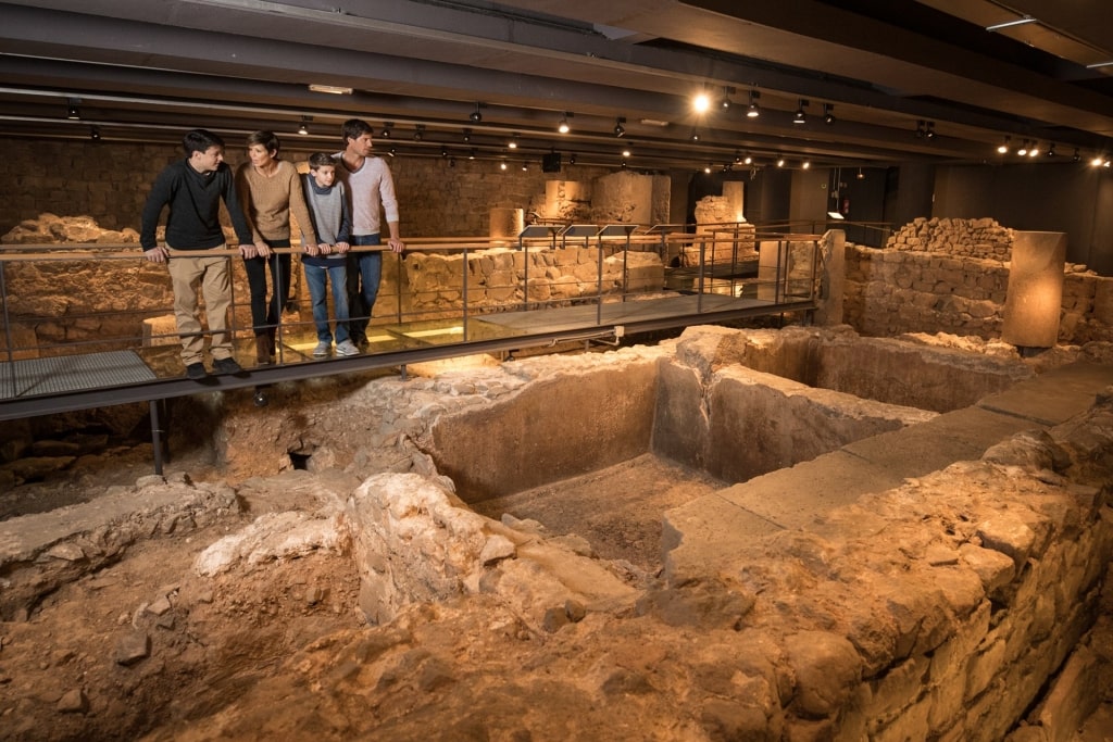 Family exploring the Museum of History in Barcelona