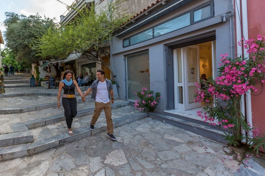 Couple walking the cobblestone streets of Plaka