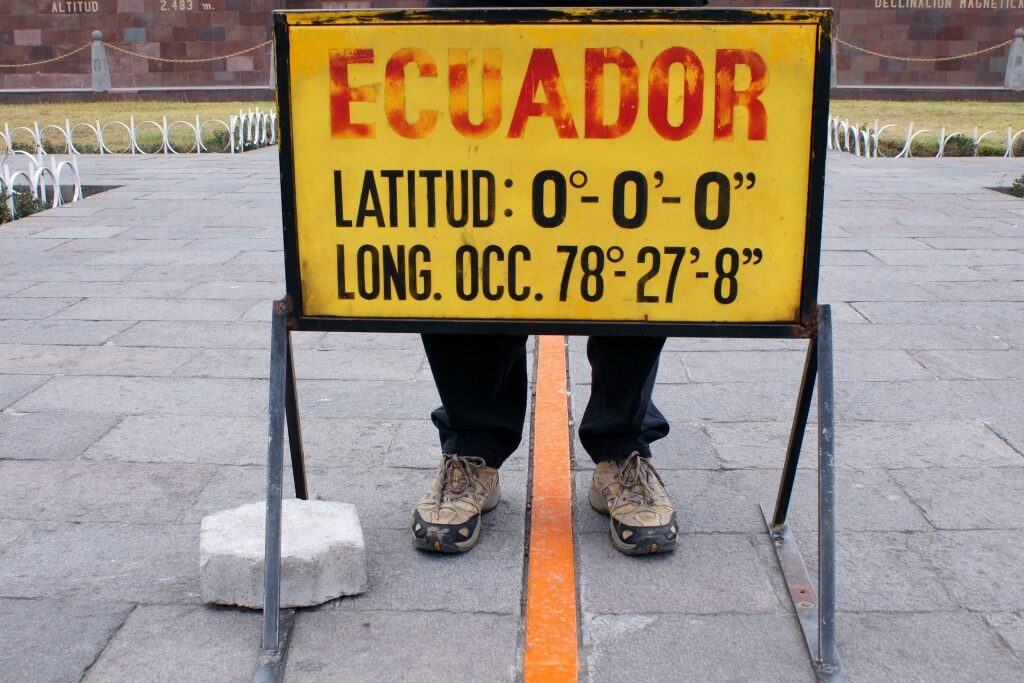 Man standing in the middle of equator line