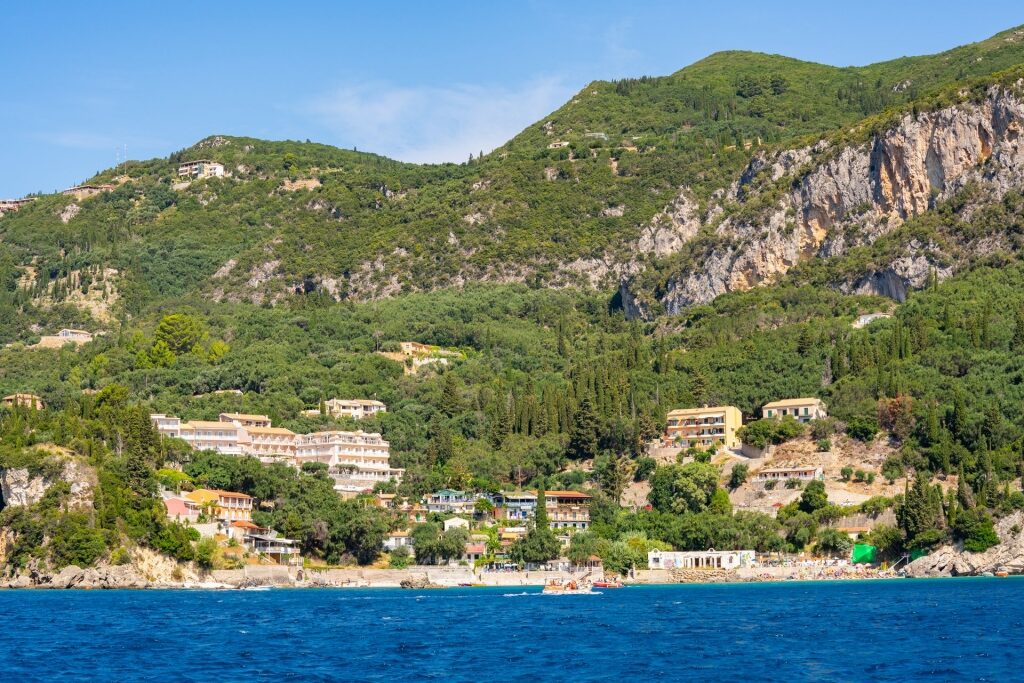 Scenic landscape of Paleokastritsa Beach with towering cliffs