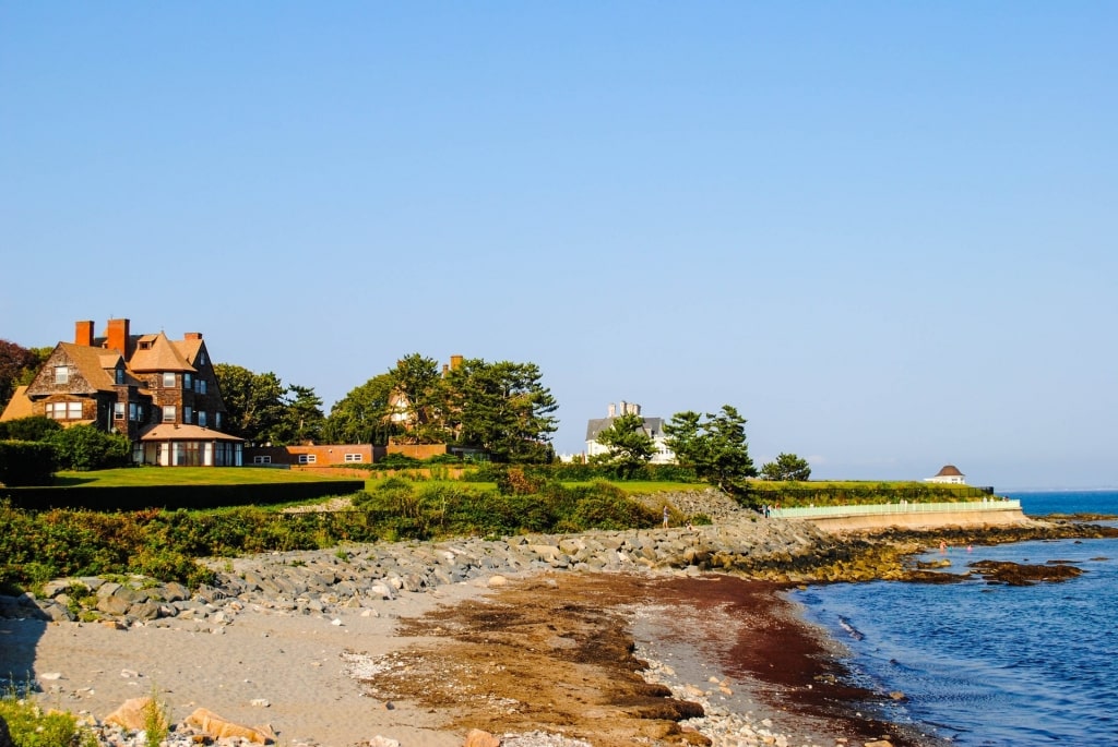 Scenic coastline of Newport Cliff Walk with mansion