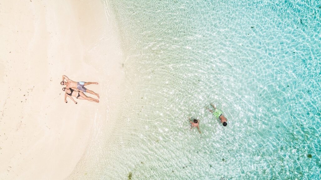 People swimming at a beach in Antigua