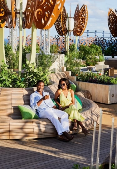 People relaxing at the rooftop garden on Celebrity
