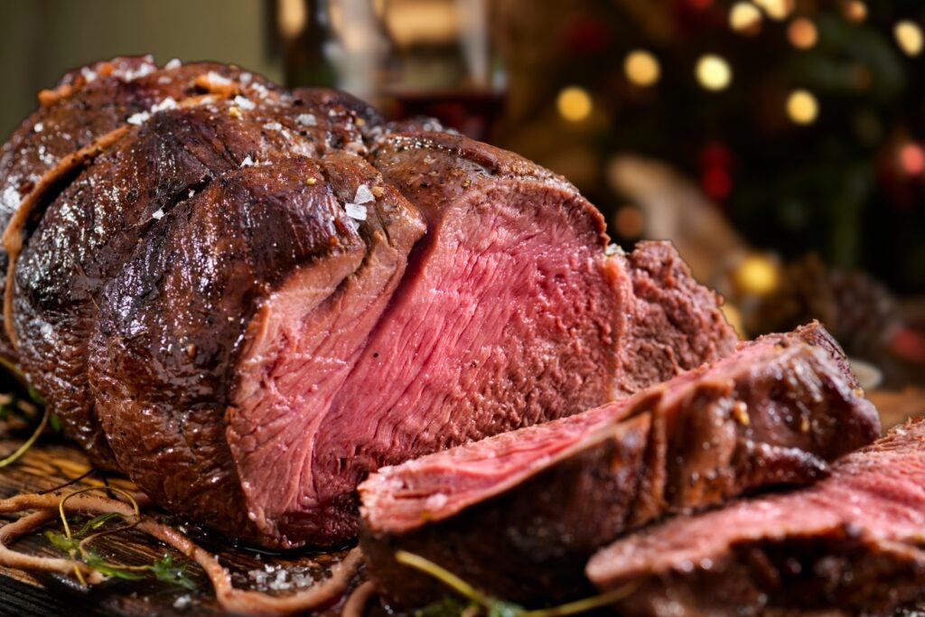 Slices of meaty elgstek on a tray