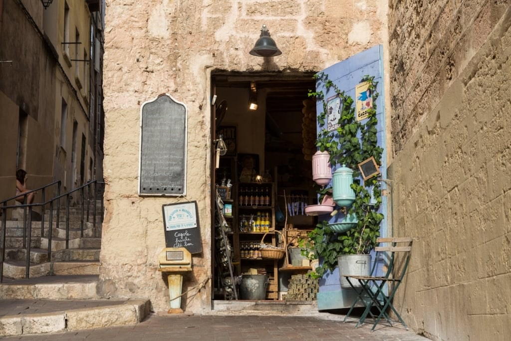 Quaint store in Le Panier with limestone alley