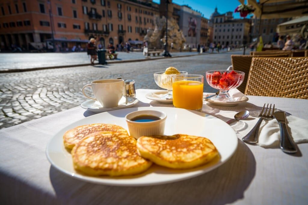 Pancakes and juice on a table
