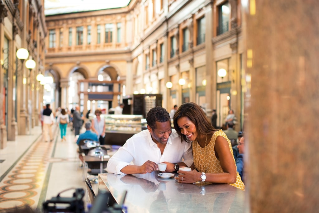 Couple drinking at a cafe in Rome