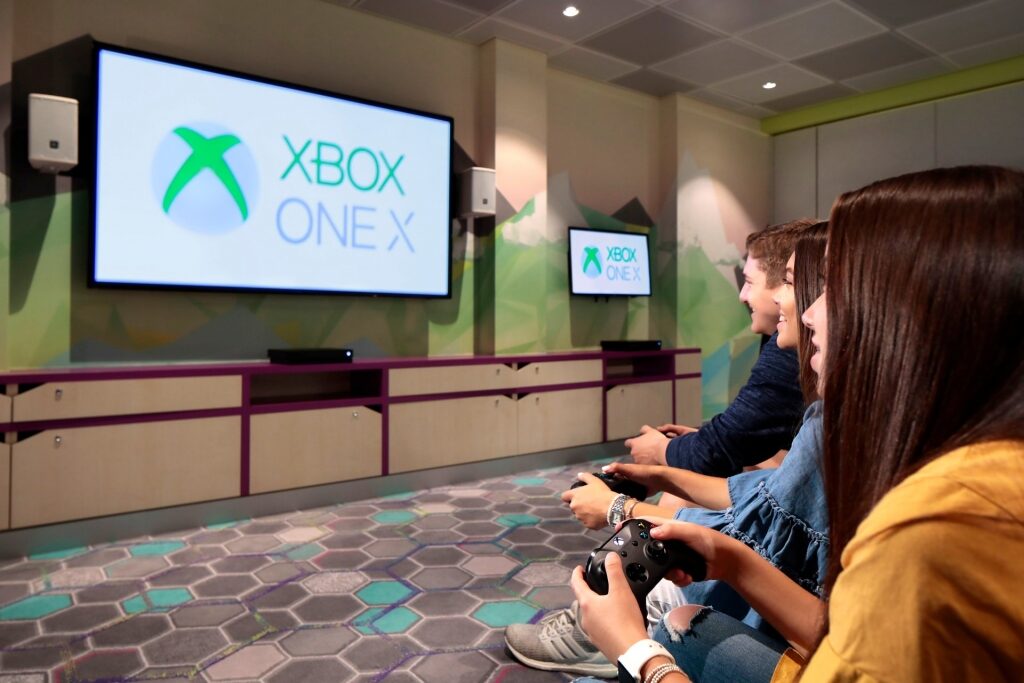 Teens playing Xbox