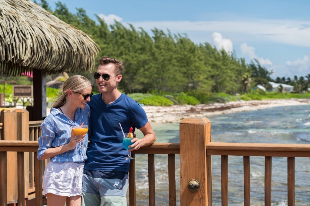 Couple drinking cocktails in Grand Cayman