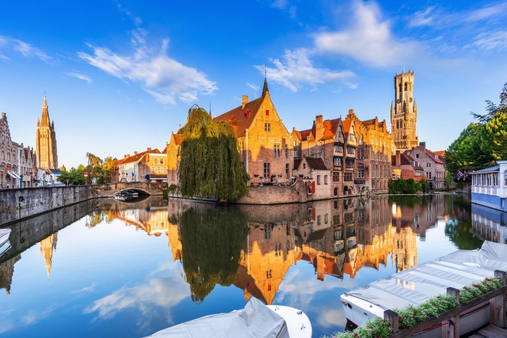 Houses along rozenhoedkaai canal reflecting on water