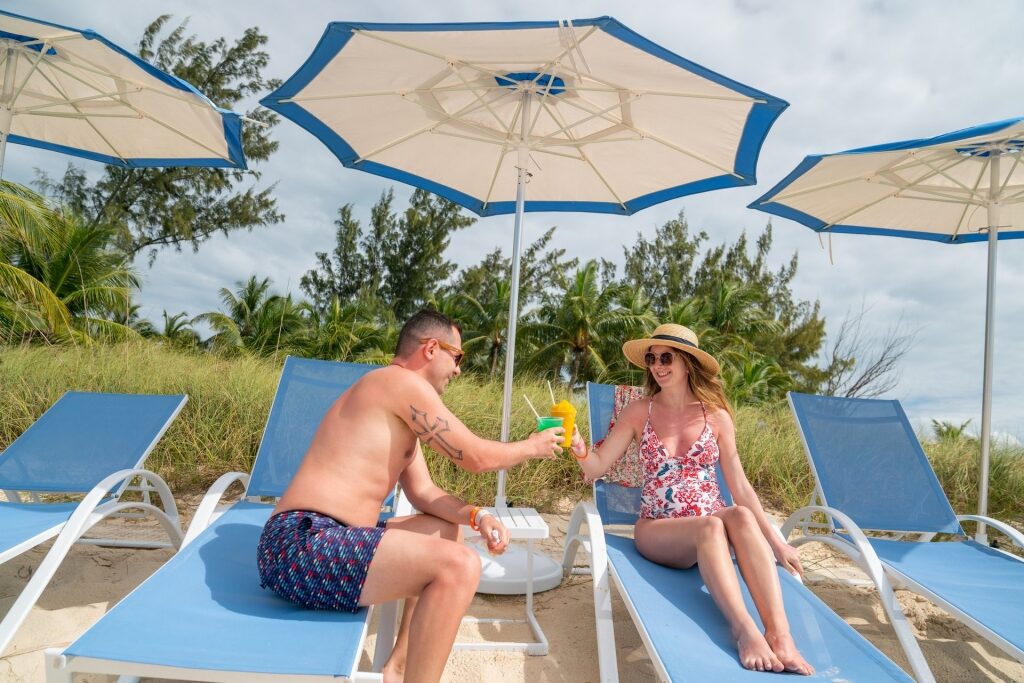 Couple drinking refreshments at a beach in Nassau