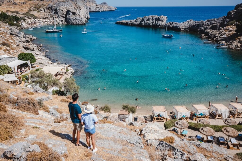Couple sightseeing from a beach in Rhodes