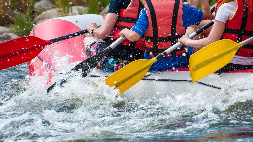 People on a whitewater rafting along Reventazón River