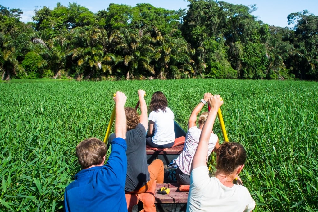 People kayaking along Tortuguero canals