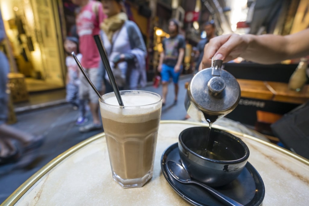 Man preparing coffee at a cafe