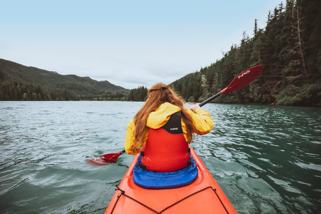 Girl kayaking in Alaska