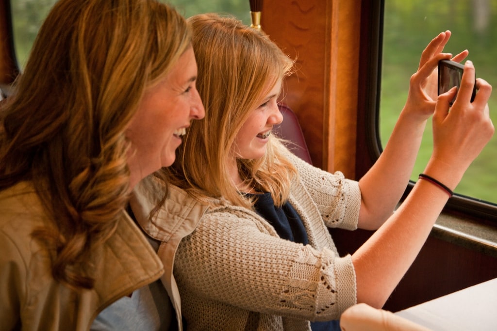 Girl taking a selfie on a train in Alaska