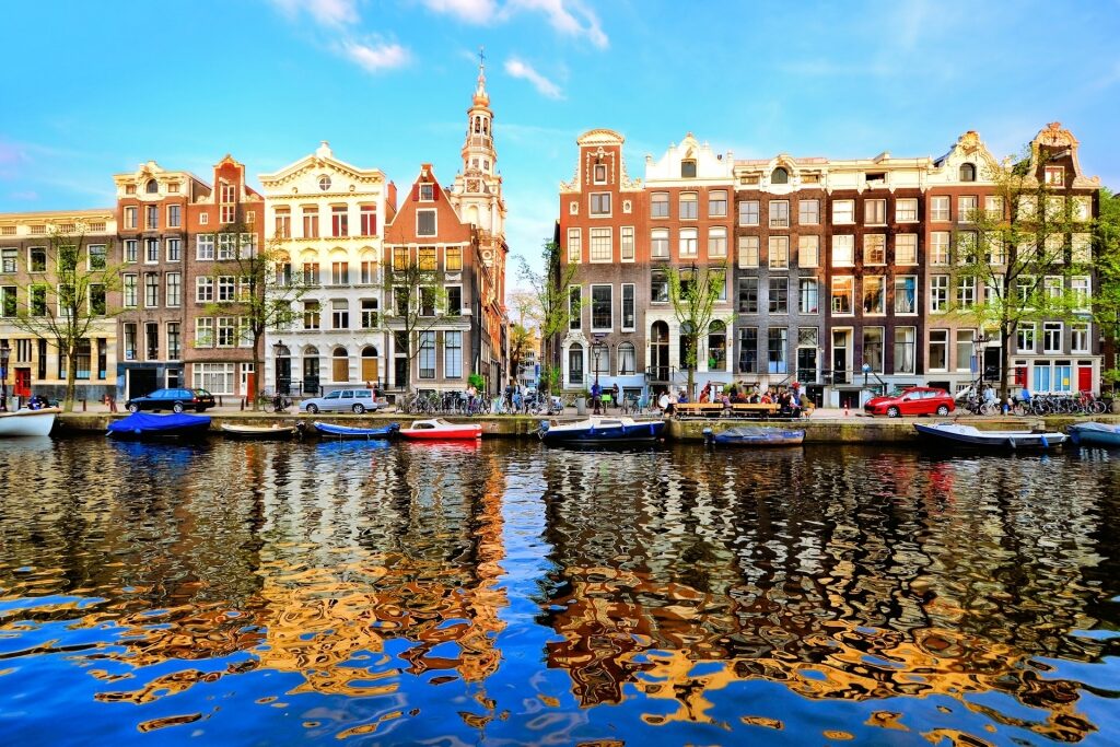 Colorful buildings in Amsterdam reflecting on water