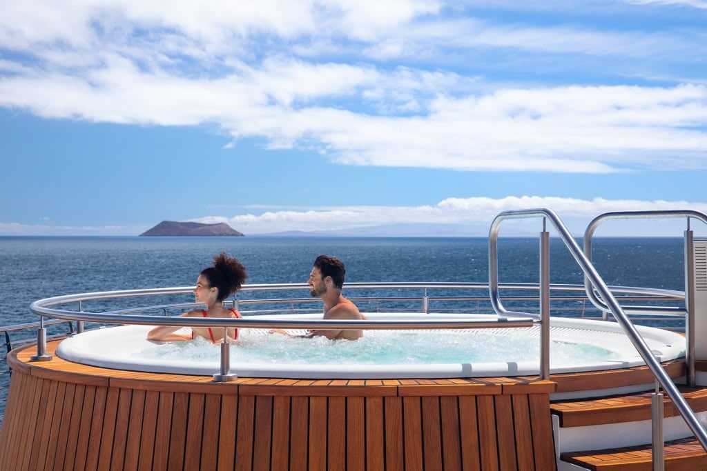 Couple in a jacuzzi aboard Celebrity Flora