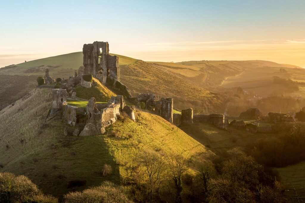 Aerial view of Corfe Castle at sunrise