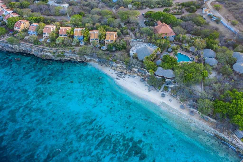 Aerial view of Playa Kalki with resorts lined up on the shore