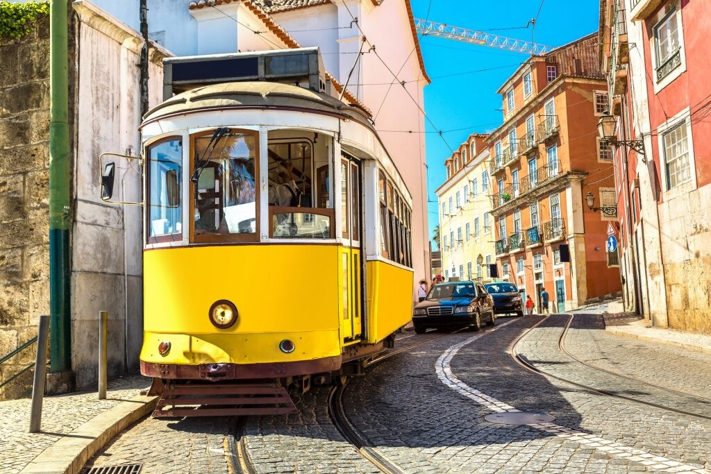 Popular Tram 28 passing by colorful buildings