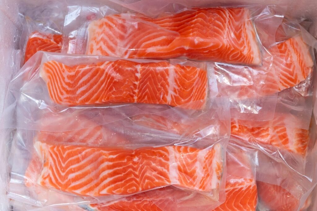 Vacuum-sealed salmon at a market