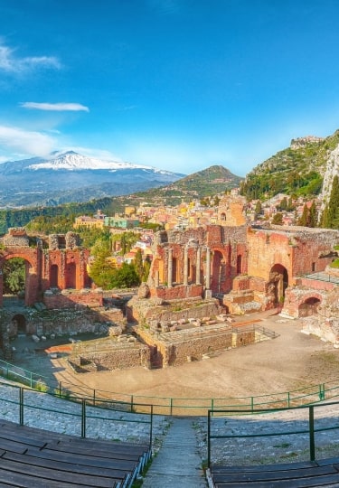 Historical Roman theater with Mt Etna as backdrop