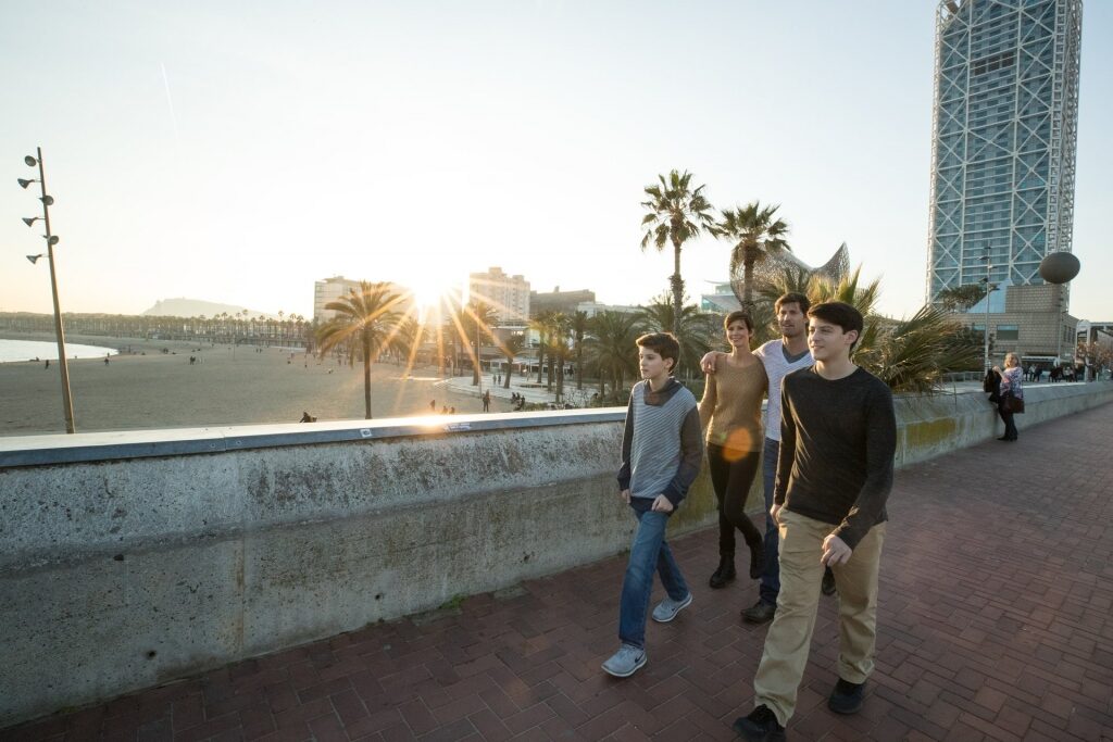 Family walking along Barcelona Pier
