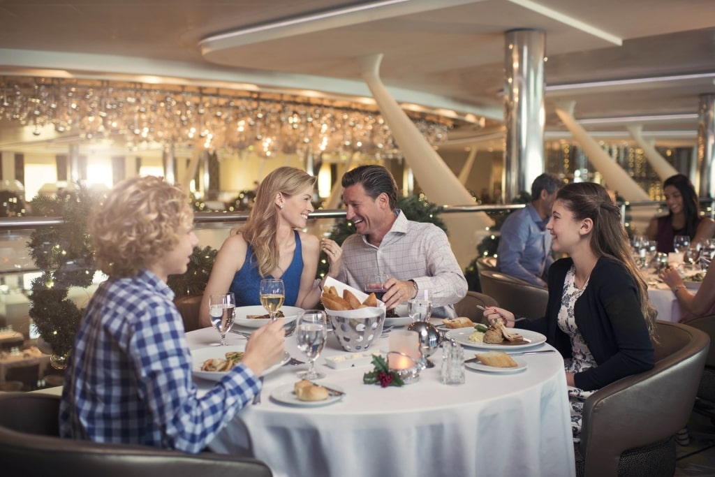 Family eating at the Main Dining Room on Celebrity