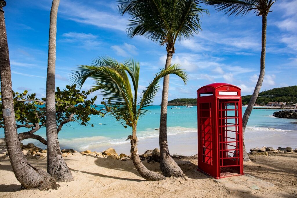 Dickenson Bay Beach with iconic red telephone booth