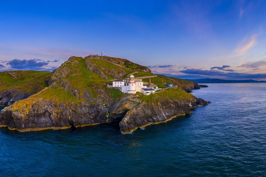 Aerial view of County Wicklow with lighthouse on the cliffside