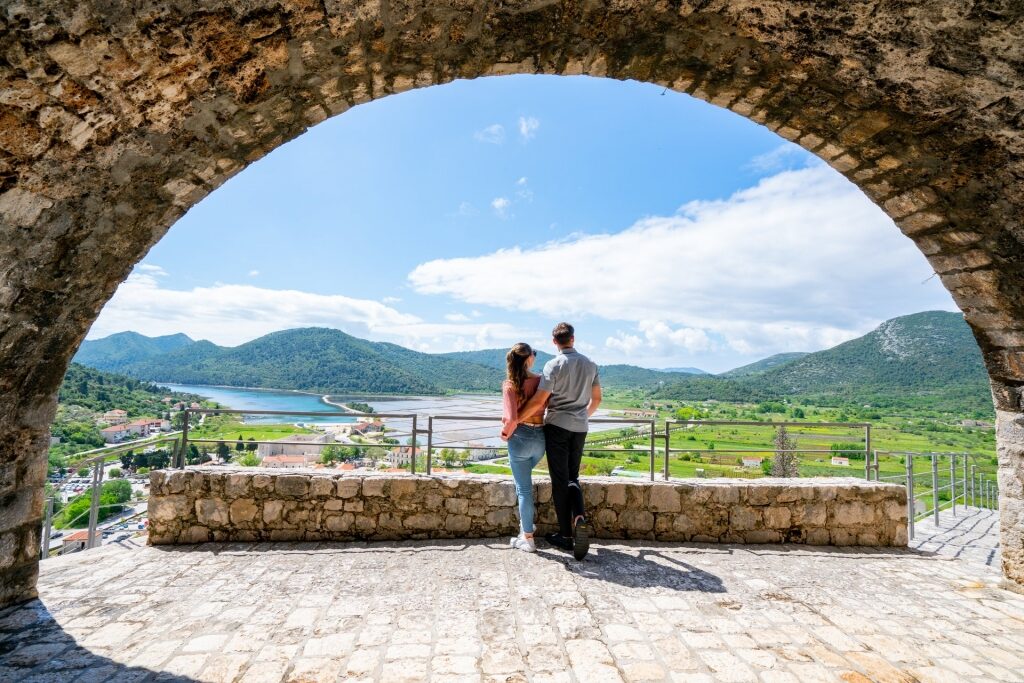Couple sightseeing from Walls of Ston
