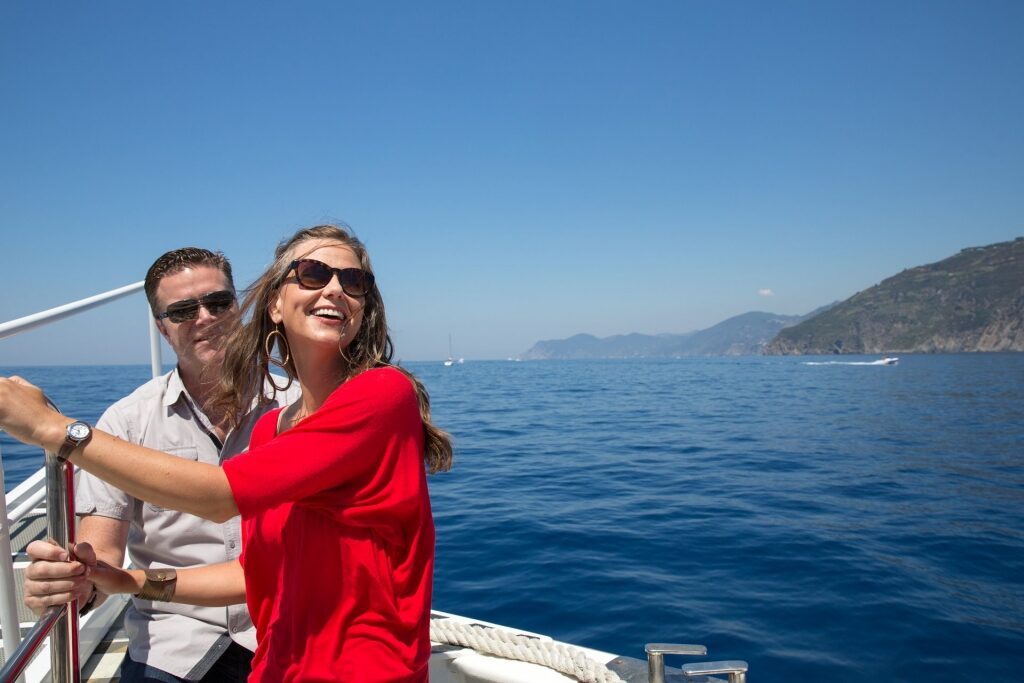 Couple on a boat ride along Cinque Terre