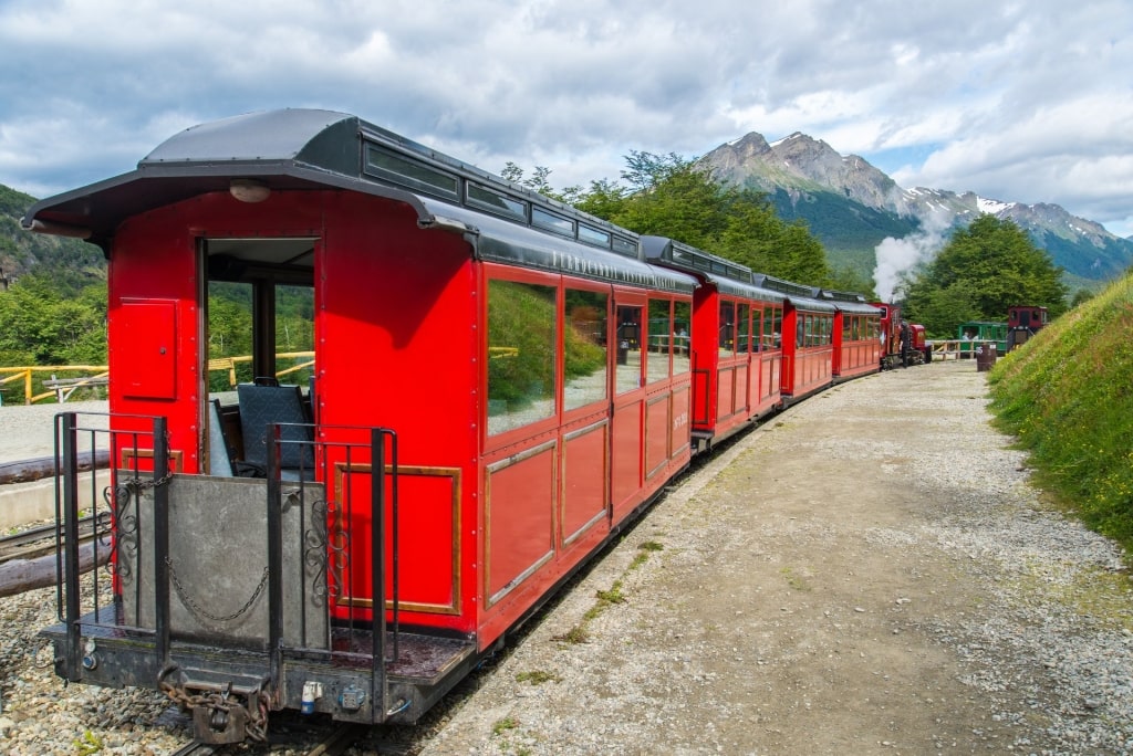 Red train with landscape view of Ushuaia