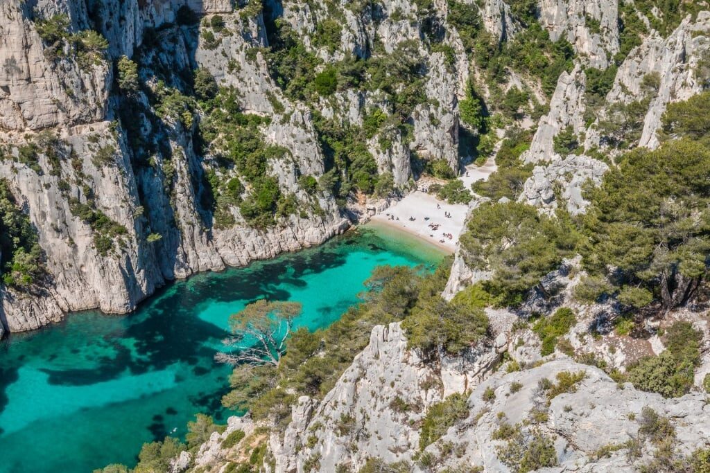 Turquoise water of Calanque d’En Vau amid the cliffs