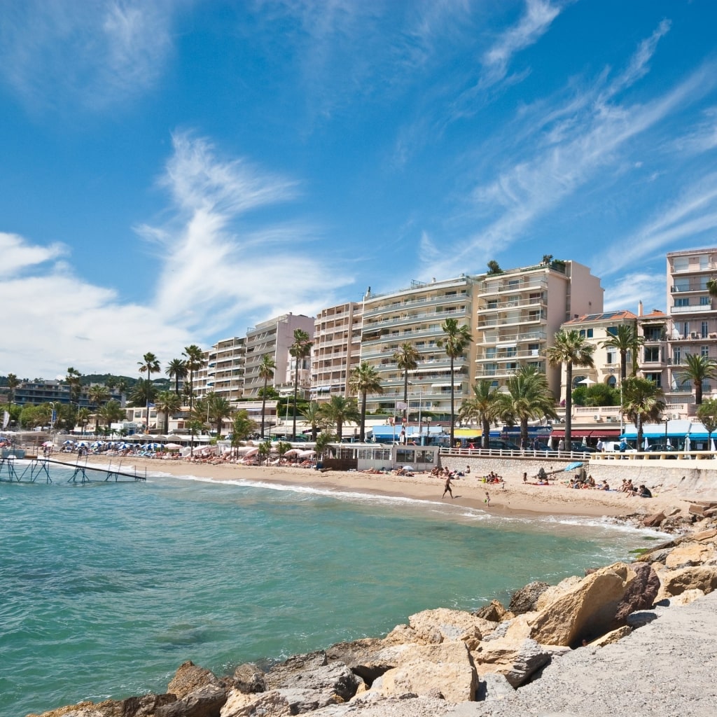 Plage du Midi with buildings by the water