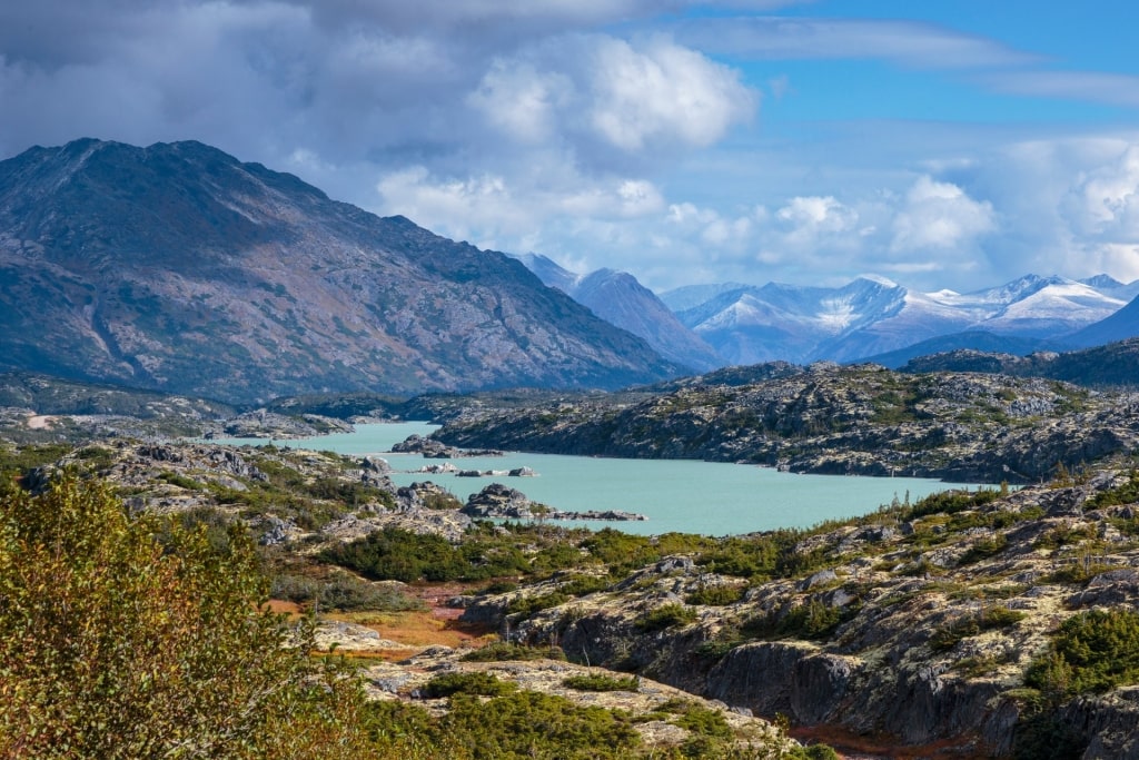 Calm waters of Summit Lake with mountains as backdrop