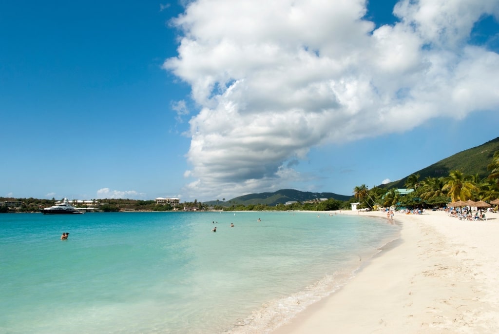 Clear blue water of Lindberg Bay Beach on a sunny day