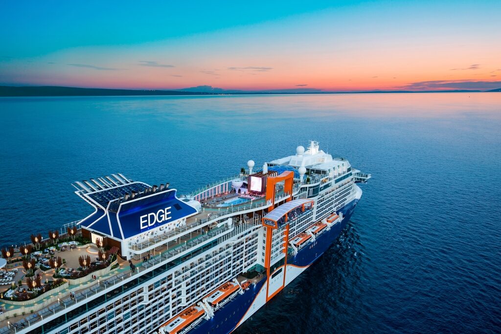 Celebrity Edge sailing at sunset