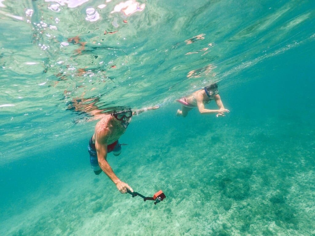 Couple snorkeling in Charlotte Amalie, one of the best Caribbean islands for couples