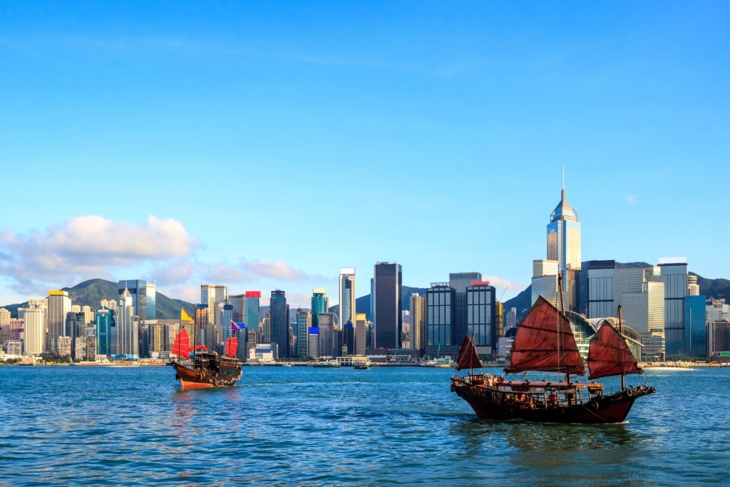 Ferry cruise in Victoria Harbor with Hong Kong skyline as backdrop