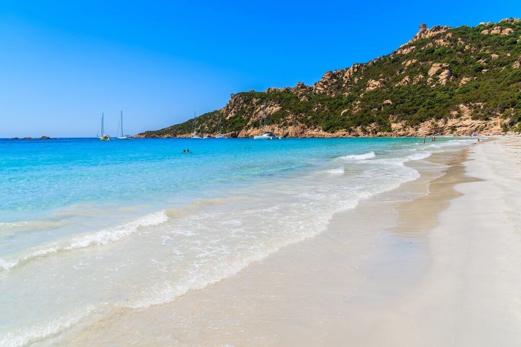 Scenic turquoise water of Roccapina Beach with white sand
