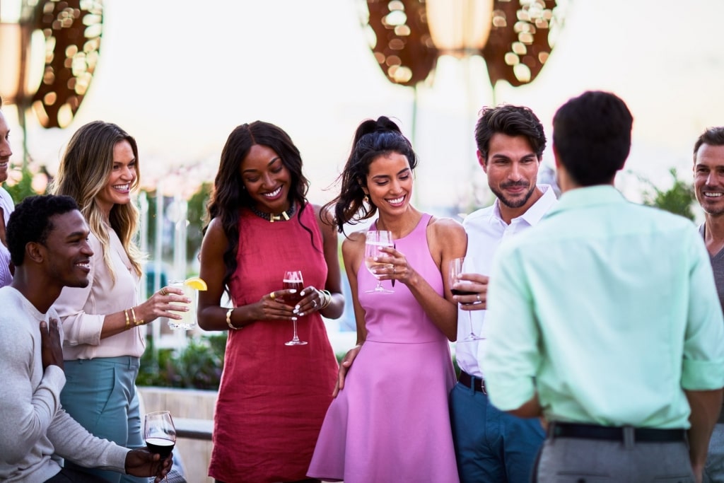 People drinking wine aboard Celebrity