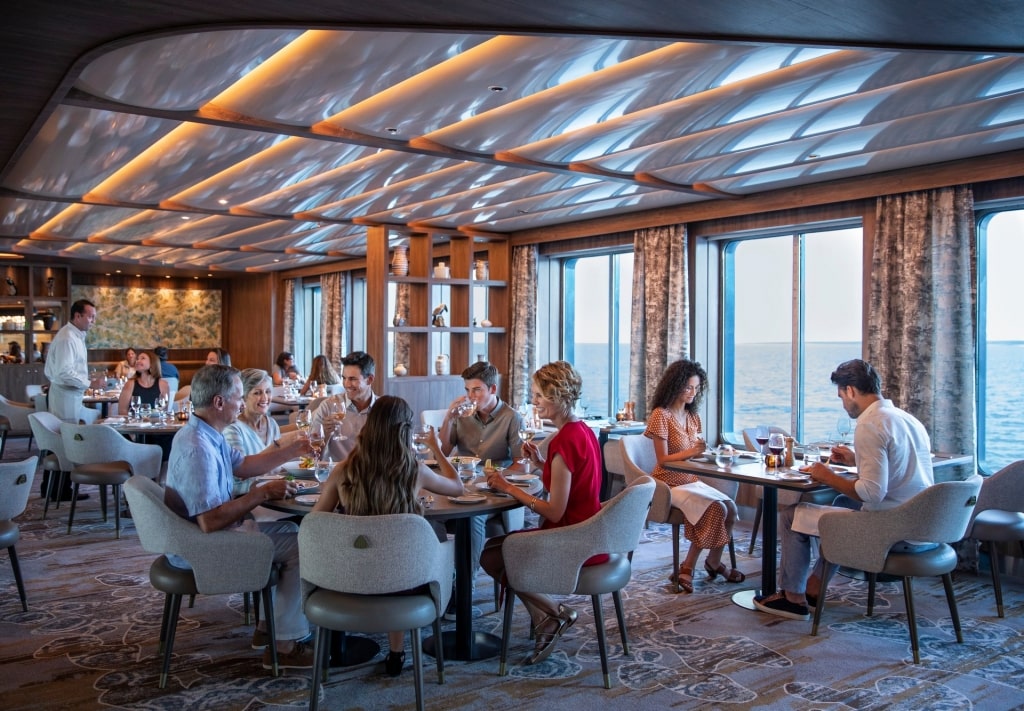 Family eating at Seaside Restaurant aboard Celebrity Flora