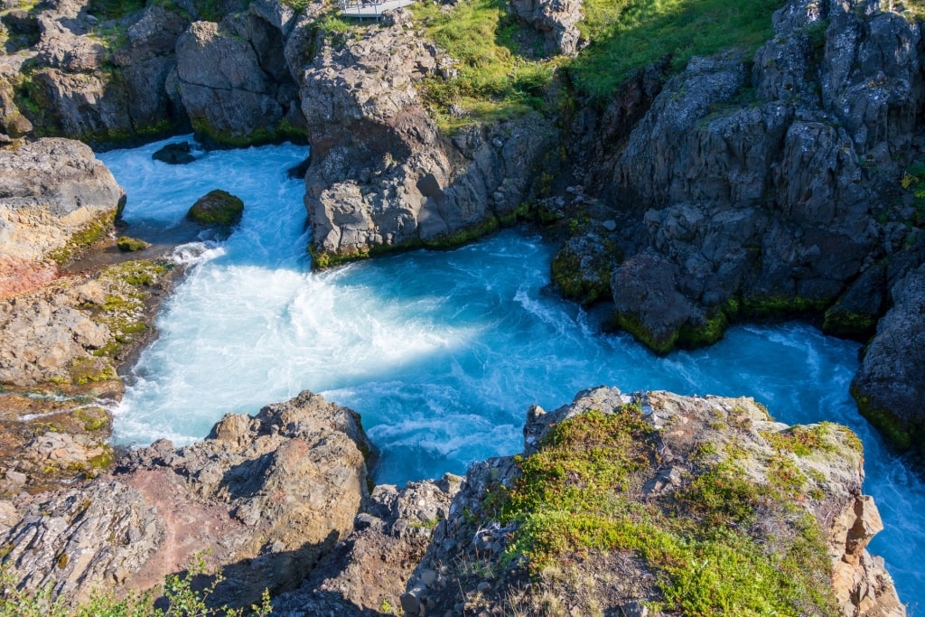 Barnafoss surrounded by rocky cliffs