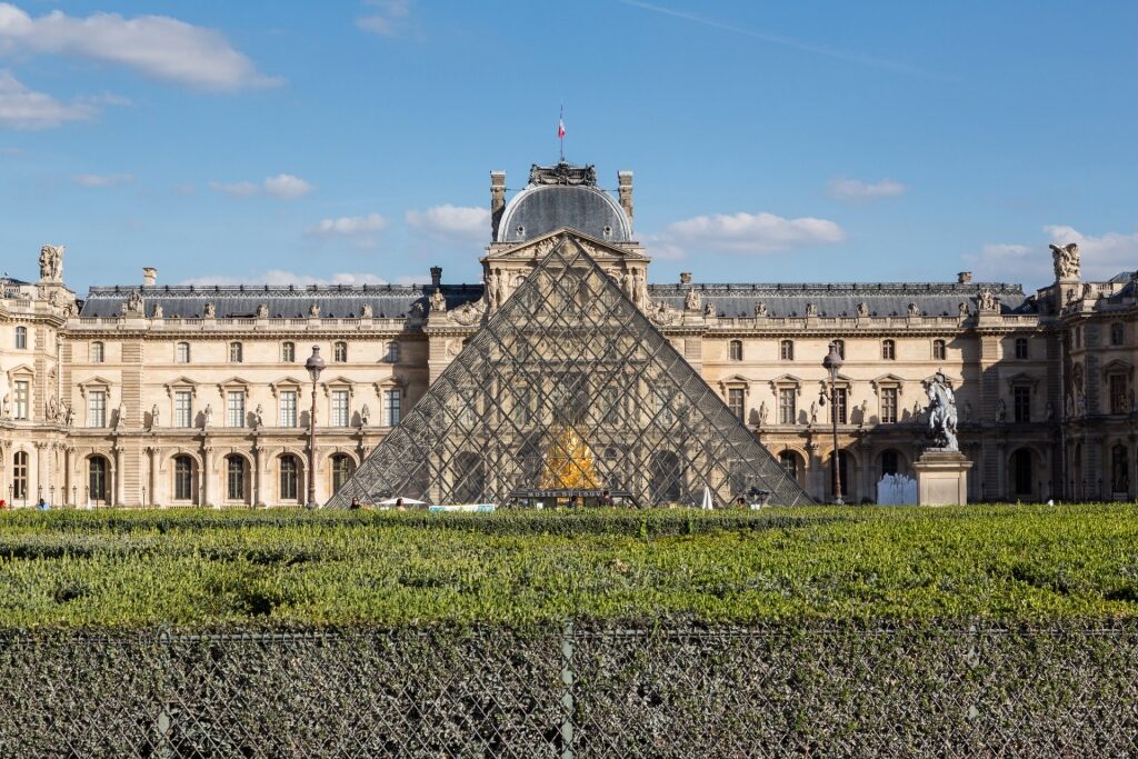 Majestic Louvre museum with famous glass pyramid